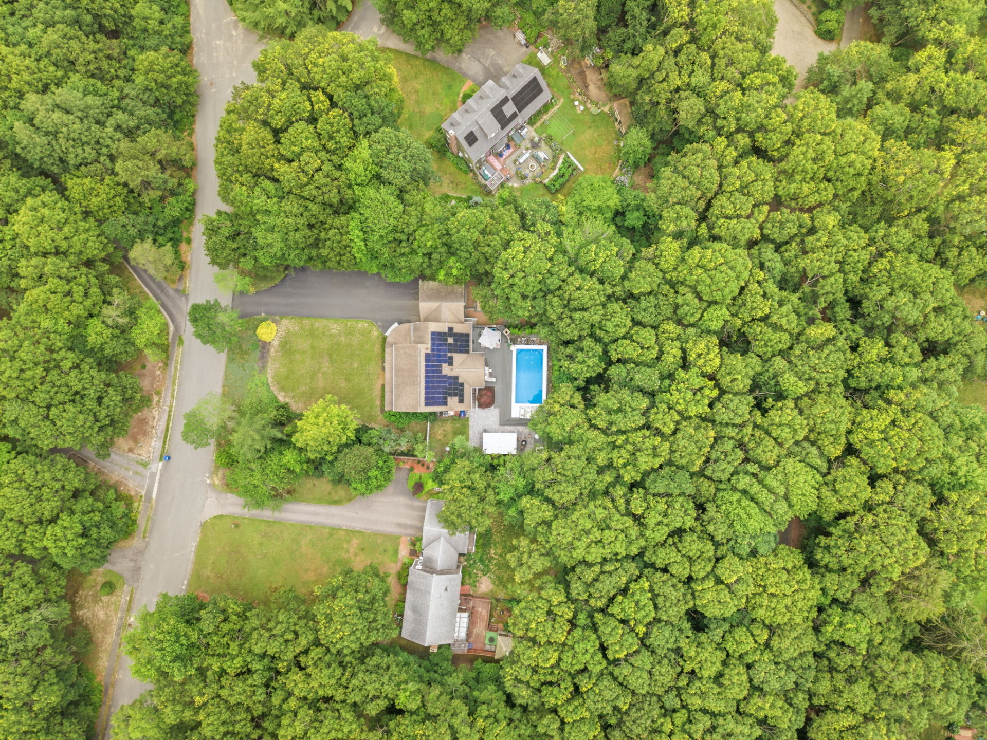 Overhead aerial of the home, deck and pool